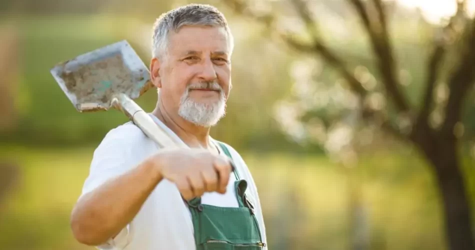 A white middle age man is smiling